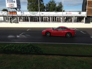 Accelerating across the start/finish line at Goodwood